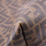 Tobacco Zucca FF monogram canvas edge with brown leather piping close-up.