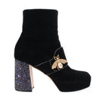 Black suede ankle boots with bee buckle strap and sparkling heel block