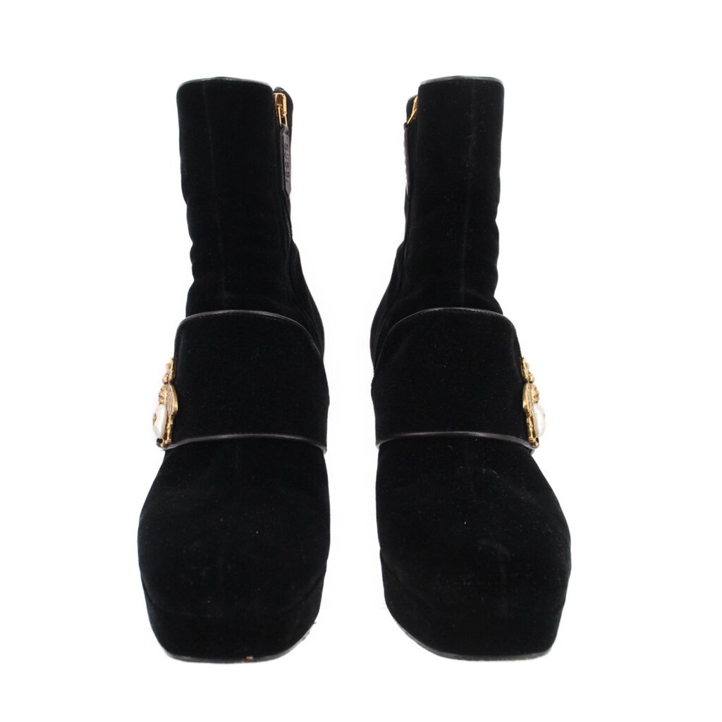 Pair of black suede ankle boots with front bee buckle and chunky heel