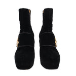 Pair of black suede ankle boots with front bee buckle and chunky heel