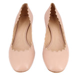 Nude leather scallop-toe heeled pumps, front view pair