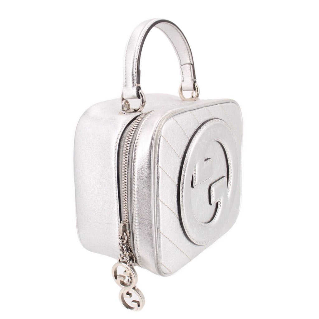 Gucci silver mini top-handle crossbody bag, side view with interlocking G detail