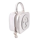 Gucci silver mini top-handle crossbody bag, side view with interlocking G detail