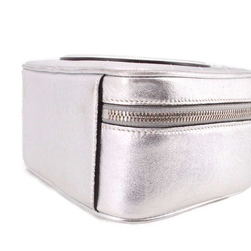 Gucci silver mini crossbody bag close-up of zipper and stitched corner edge