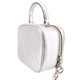 Gucci silver mini top-handle crossbody bag, angled side view with stitched panels