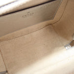Gucci silver crossbody bag interior with beige lining and stitched logo label
