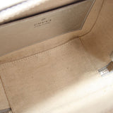 Gucci silver crossbody bag interior with beige lining and stitched logo label