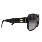 CHANEL oversized square sunglasses, black with gold CC logo on side and dark lens