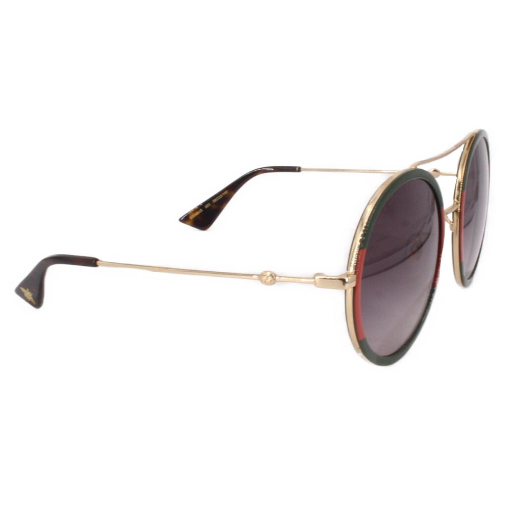 GUCCI round sunglasses with red-and-green frames and dark tinted lenses, side view
