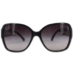Black oversized square sunglasses with dark lenses and white CHANEL logo at center.