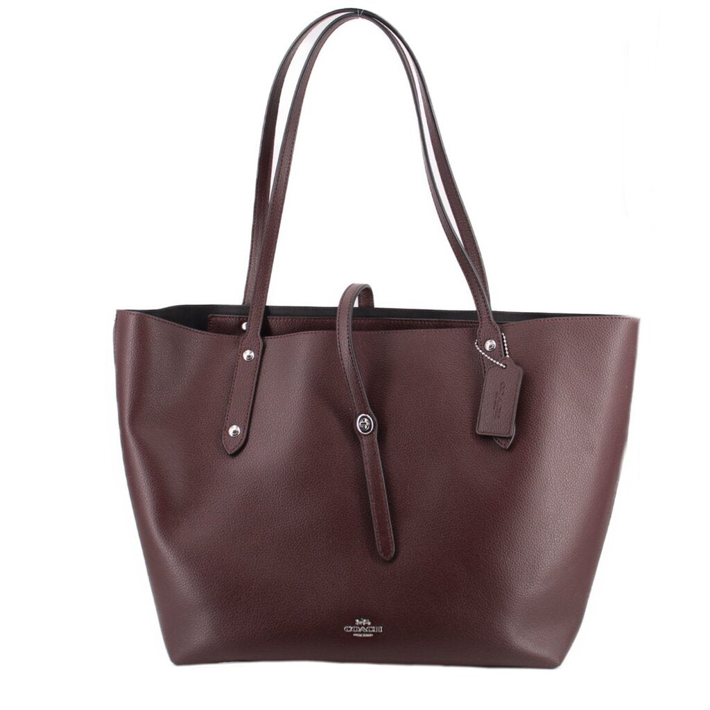 Coach market tote bag in burgundy leather, top handles and front pockets