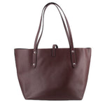 Coach market tote bag in burgundy leather with two front strap tabs