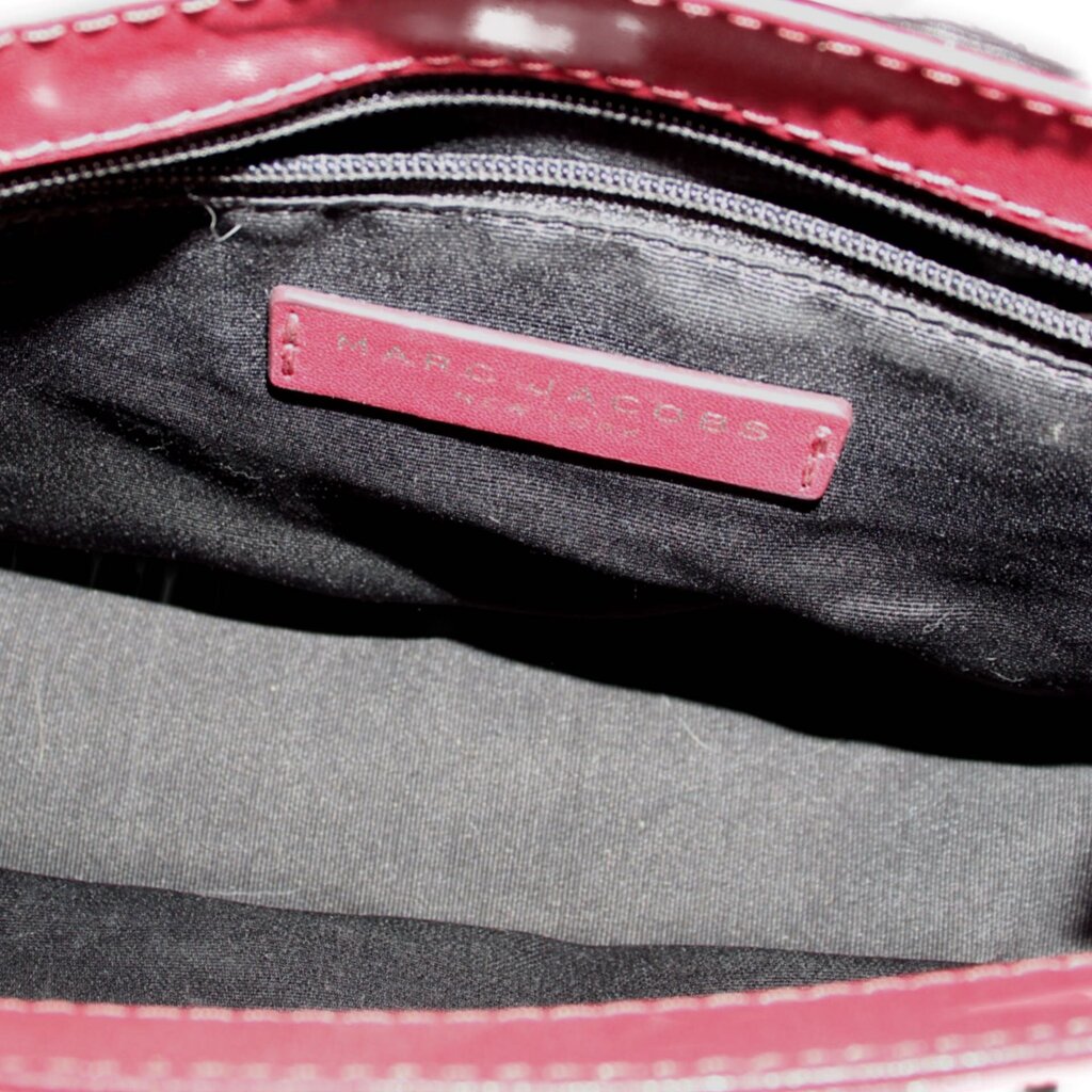 Crossbody bag interior with MARC JACOBS logo patch and fabric lining