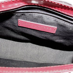 Crossbody bag interior with MARC JACOBS logo patch and fabric lining
