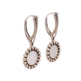 Silver-tone hinged drop earrings with round mother-of-pearl disc and beaded halo setting