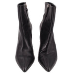 Pair of black ankle booties with pointed toe and side zipper
