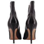 Black ankle booties with pointed back, stiletto heel, side zipper