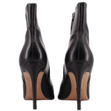 Black ankle booties with pointed back, stiletto heel, side zipper