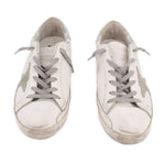Pair of white mixed leather lace-up sneakers with gray paneling and beige sole