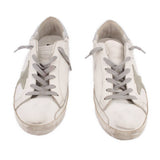Pair of white mixed leather lace-up sneakers with gray paneling and beige sole