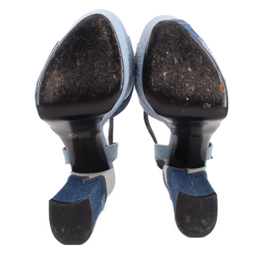 Denim patchwork heeled sandal view of underside with black soles and heel caps