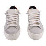 Pair of white leather platform sneakers, lace-up with orange interior at the heel