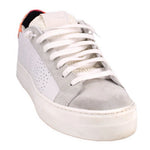 White leather platform sneakers with lace-up front, perforated toe and thick sole