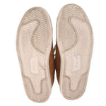 Light outsoles with zigzag tread and small 'Polo' marking.