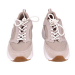 Gray low-top sneakers pair with white laces, mesh uppers, brown-brown outsole