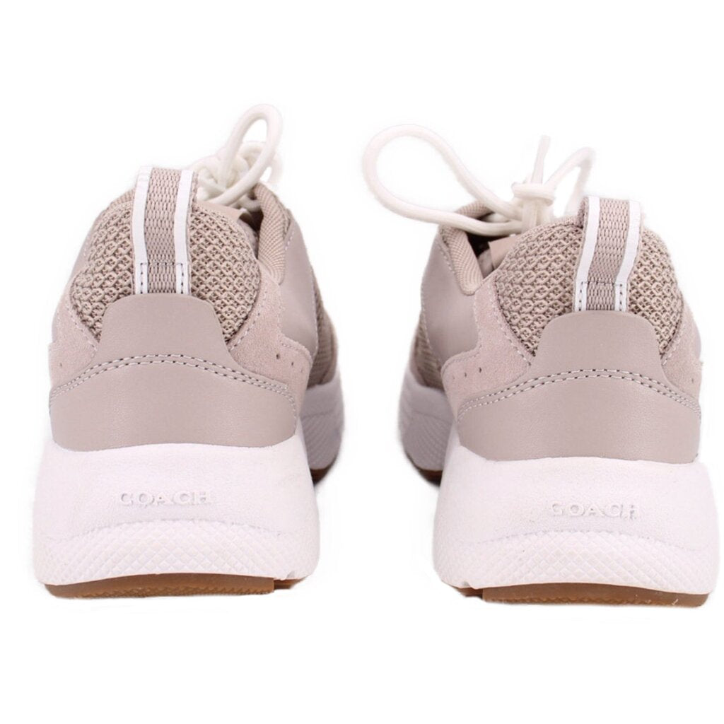 Gray sneakers heel view with COACH logo on white sole, brown outsole