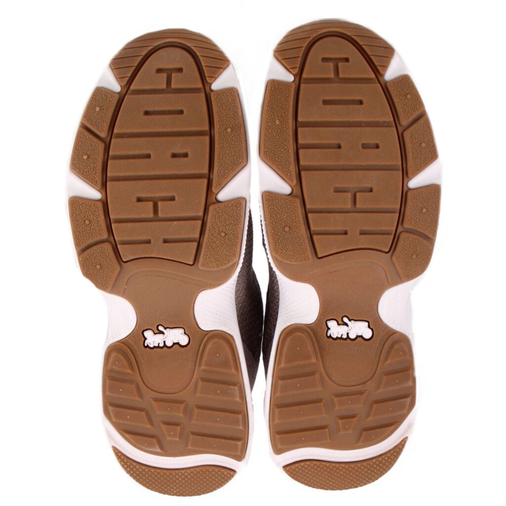 Brown tread sneaker outsoles with white rubber panels, two bottom views