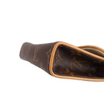 Close-up of monogram belt bag interior opening with tan leather edge