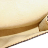 Beige leather-lined interior of a Louis Vuitton monogram belt bag