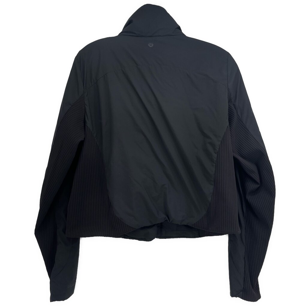 Black hooded activewear jacket, back view with textured sleeve panels