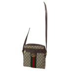 GUCCI small crossbody bag with GG canvas, web stripe, and adjustable leather shoulder strap