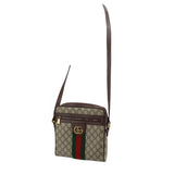 GUCCI small crossbody bag with GG canvas, web stripe, and adjustable leather shoulder strap