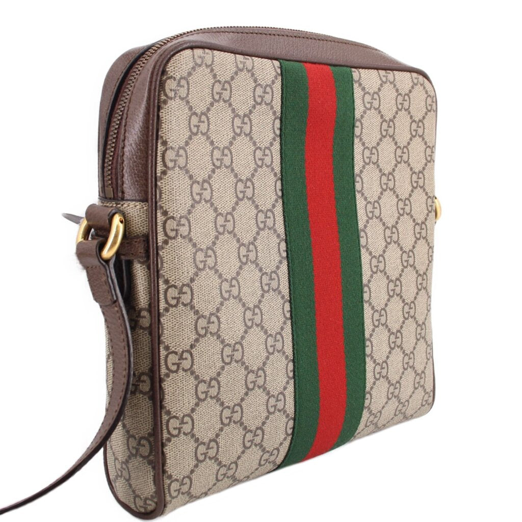 GUCCI crossbody messenger bag with GG canvas, brown piping, and vertical green-red web stripe