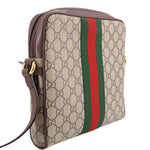 GUCCI crossbody messenger bag with GG canvas, brown piping, and vertical green-red web stripe