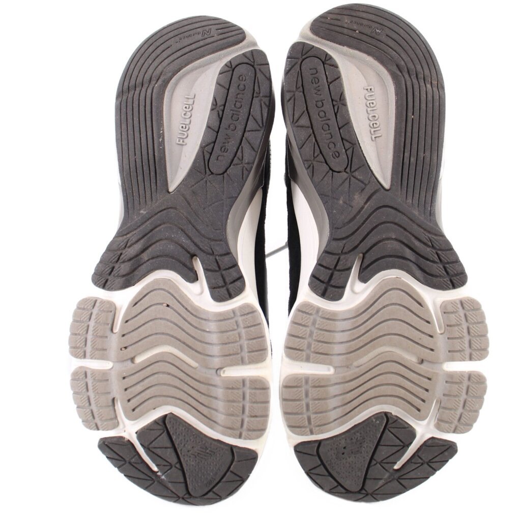 Pair of New Balance sneakers with sculpted rubber outsoles and deep tread