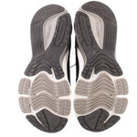 Pair of New Balance sneakers with sculpted rubber outsoles and deep tread