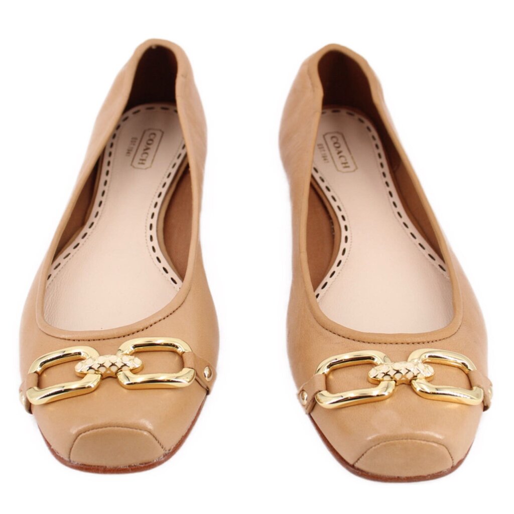 Tan leather flats pair with gold hardware horsebit detail and stitched toe.