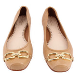 Tan leather flats pair with gold hardware horsebit detail and stitched toe.