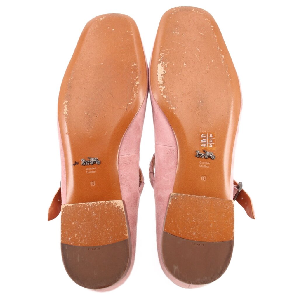 Pink suede flat soles and insoles, showing wear marks and size stamp