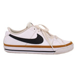 Side view of white Nike leather sneaker with black Swoosh and tan midsole stripe