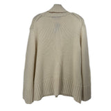 Back of a cream cashmere sweater with a high folded neck and ribbed cuffs and hem