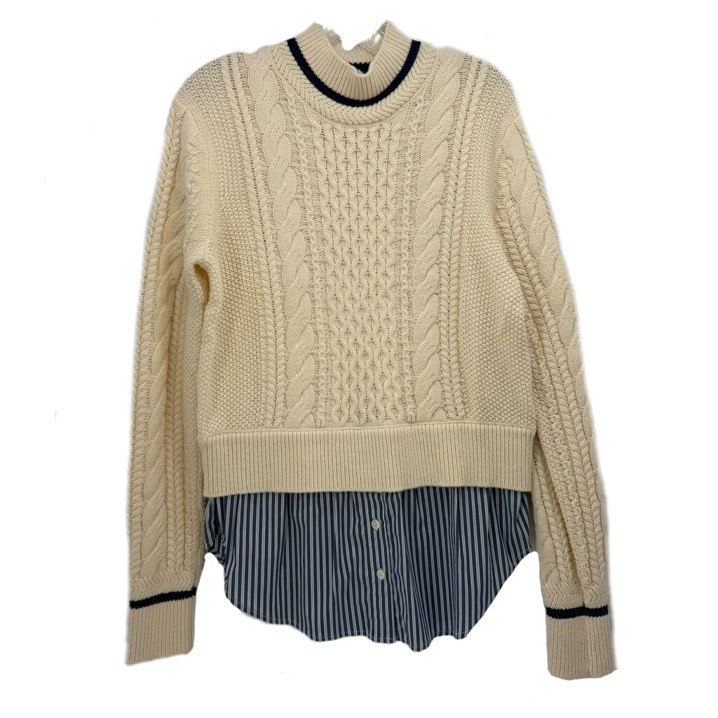 Cream cable-knit sweater with navy striped peplum hem and ribbed crew neckline