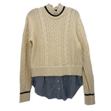 Cream cable-knit sweater with navy striped peplum hem and ribbed crew neckline