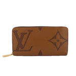 Monogram zip wallet in brown with LV pattern and gold zipper hardware