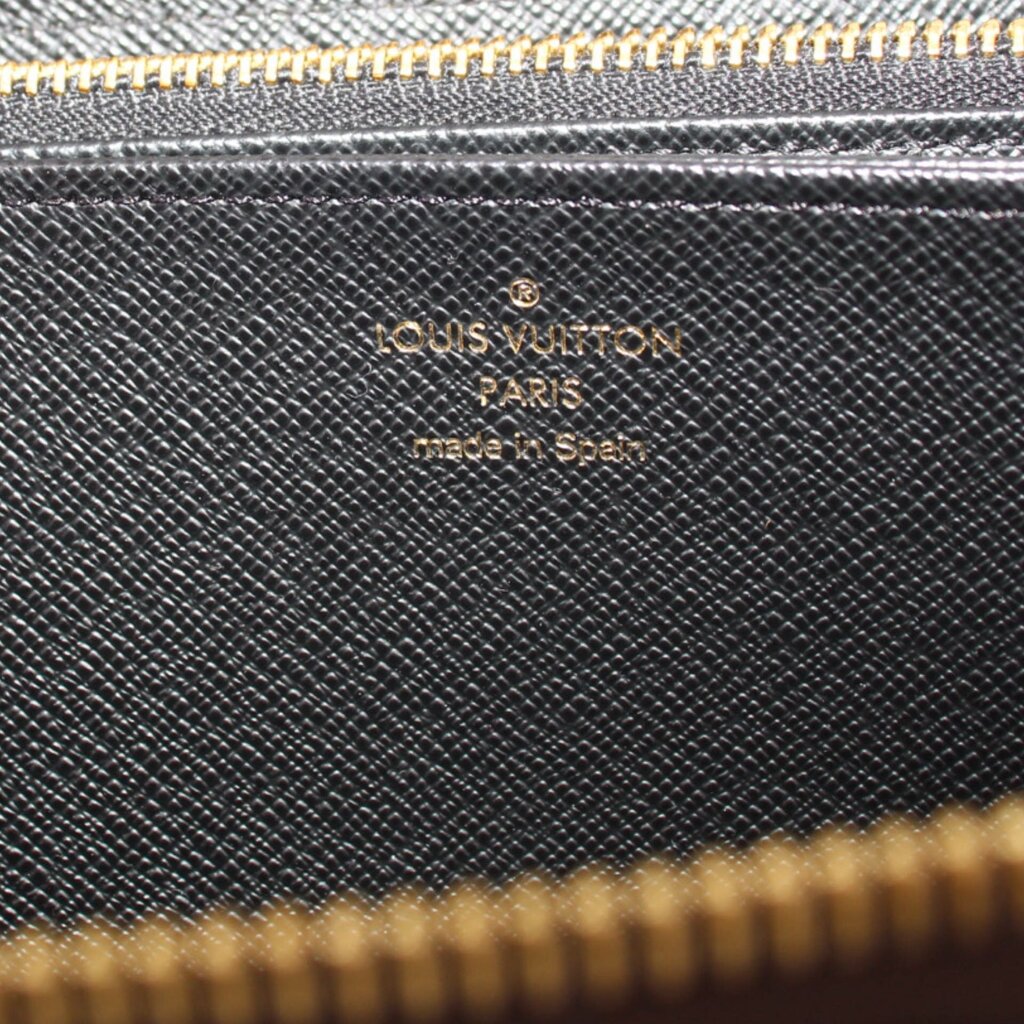 Black interior panel with Louis Vuitton Paris logo text and monogram texture