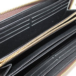 Black interior card slots of monogram zip wallet with gold zipper trim
